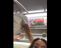 Man writes at train windows using markers