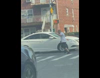 Man white shirt dance middle of street