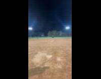 Man double hits pitch on baseball 