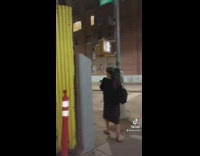 Guy walks by random woman in black dress acts crazy