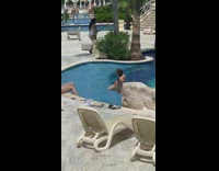 Woman orange bikini swimming pool photo shoot Part 2