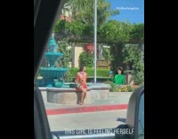 Orange skirt girl blue water fountain car