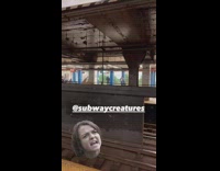 Guy plays electric guitar at subway station 