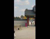 Man in a Squid Game guard costume at the entrance