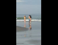 Couple beach sand blue shorts seagulls 