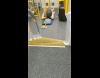 guy on blue yoga mat rolling on stomach