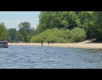 two boys take pics two girls lake shore