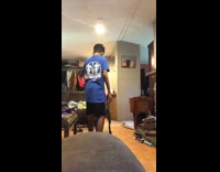 Kid stands on couch rope toy dog