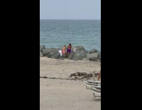 Couple kiss make out on rock beach part 2