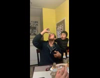 Guy chugs beer bottle, little brother sees him drinking and makes shocked face