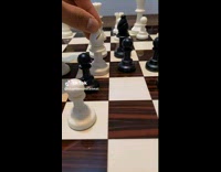 Collab ClipsIG - Man Flicks Queen Chess Piece and Lands Upward