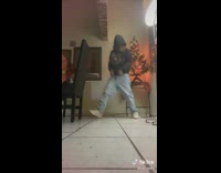 Person slips on floor while doing a dance