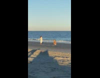 Woman poses and does photoshoot at the beach 