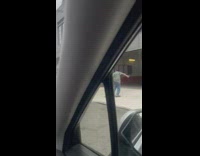 Man and woman arguing in street bottle