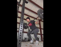 Guy working out looks at door outside