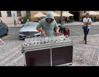 Man use wine glasses with water as instrument
