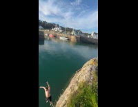 Man almost hit rock doing flip on lake