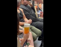 Woman holds pigeon chick inside the subway