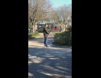 man selfie stick video park