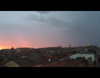 Sunset on the horizon on a stormy weather at the city