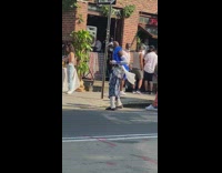 Guy blue feather boa white gloves dances 