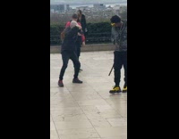 Guy taking picture of guy taking video of rapper