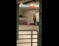 Guy works out with resistance band station 