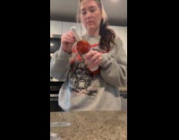 Woman shakes bottle and bursts