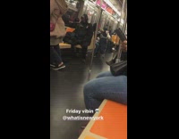 Guy on subway wears black gas mask 