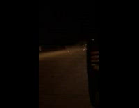 Car driving fast makes a small jump and lands while grinding bottom