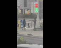 Guy helps stranger with stretch technique 