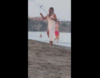 Woman white bikini dress selfie monopod beach