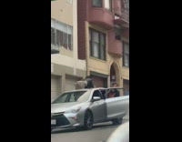 Girl twerks car sunroof black shirt guy  