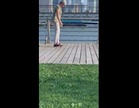 Lady walks something stuck on black shoe 