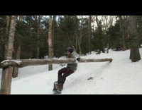 Guy fail snowboard rail flip over stand up