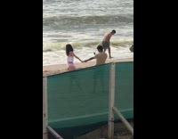 Couple Poses for Hand Holding Beach Photo