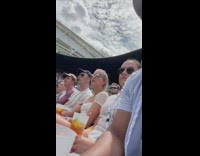 Crowd move their heads at the same time 