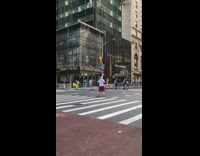 Collab WINY - Man in Anthony shirt shouts in the middle of street intersection with soccer ball