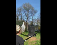 Guy throws chalk shoots with bow arrow 