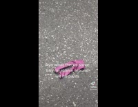 Small pair of pink pants jeans on floor