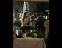 Woman black backless dress look behind restaurant