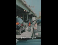 Red shirt guy dances street traffic stoplight 