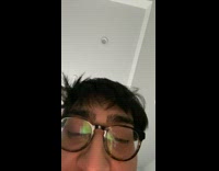 Guy rips black sock off foot 