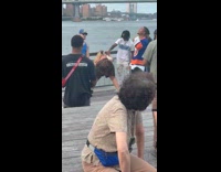 Woman twerks for music video at pier