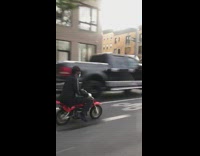 Black hat guy small red motorcycle street 