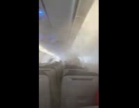Man shows boarding plane filled with smoke