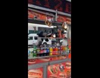 Pigeons eat hotdogs on food cart street