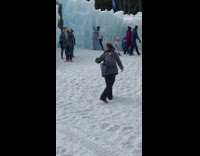 Couple dance woman spin beside ice castles