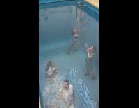 IITW - girl takes picture under clear pool floor