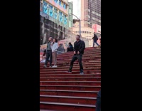 Man films video dances at the stairs